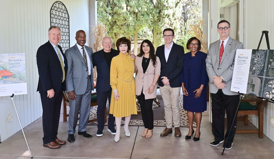 Celebrating the announcement, from left: Shaun Keister, vice chancellor of Development and Alumni Relations; Chancellor Gary S. May; Stewart Resnick; Lynda Resnick; Deysi Alvaro Ceja, a third-year plant sciences major; Christopher Simmons, professor and chair of the Department of Food Science and Technology; Helene Dillard, dean of the College of Agricultural and Environmental Sciences; and Jim Carroll, university architect and associate vice chancellor of Design and Construction Management. (Stefanie Keena