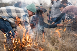 UC Davis students, academics and members of the local Native American community take part in a collaborative cultural burn at the Tending and Gathering Garden at the Cache Creek Nature Preserve in Woodland.